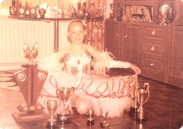 Adoptee Amanda Village as a young girl with her dancing trophies